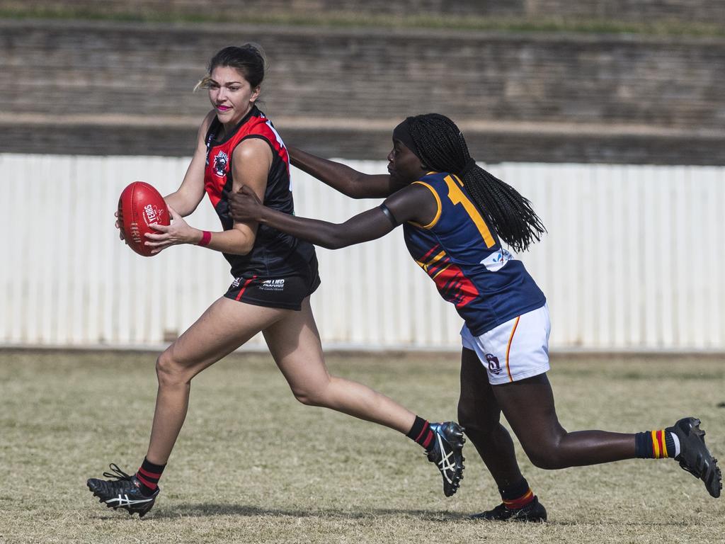 Lauren McKeiver (left) of South Toowoomba is tackled by Brittany Ladu of University in AFL Darling Downs senior women's round 9 at Heritage Oval, Saturday, June 19, 2021. Picture: Kevin Farmer