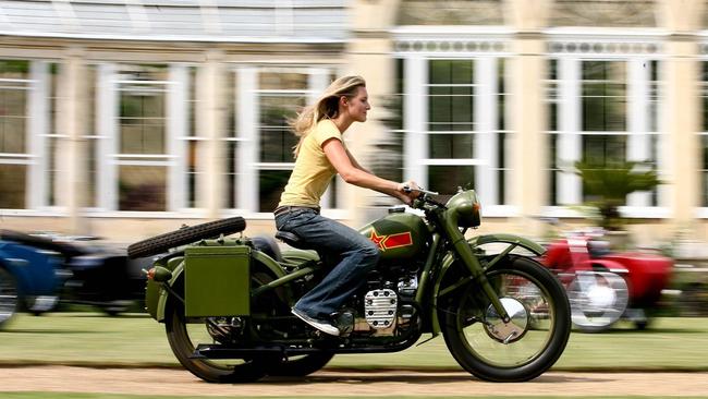 Mark Carnegie’s partner Lady Katie Percy on a Chang Jiang imported Chinese motorcycle Picture: Getty Images