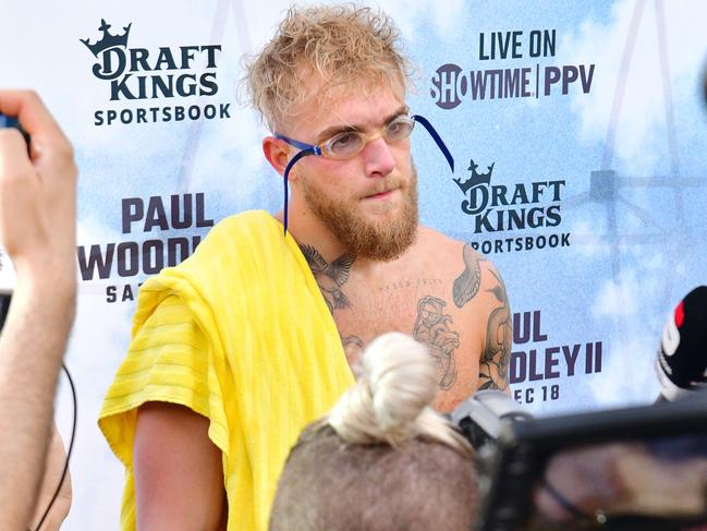 TAMPA, FLORIDA - DECEMBER 15: Jake Paul is interviewed during a media workout at the Seminole Hard Rock Tampa pool prior to her December 18th fight against Tyron Woodley on December 15, 2021 in Tampa, Florida.   Julio Aguilar/Getty Images/AFP == FOR NEWSPAPERS, INTERNET, TELCOS & TELEVISION USE ONLY ==