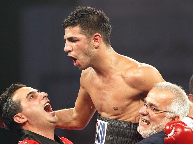 Billy Dib and his team celebrate after winning the IBF Featherweight World Title in 2012.