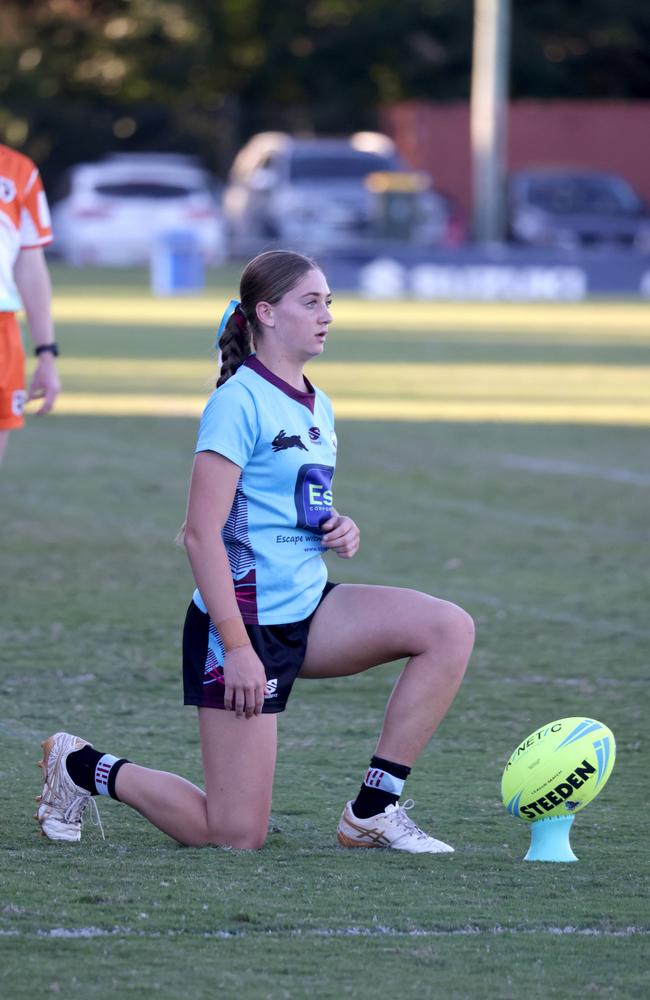 Keebra Park’s Torah Luadaka kicking for goal. - Photo Steve Pohlner