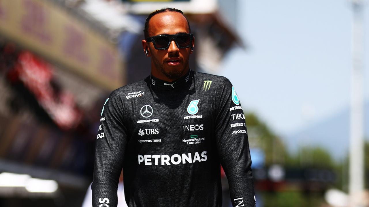 BARCELONA, SPAIN - MAY 22: Lewis Hamilton of Great Britain and Mercedes rides a scooter to the grid prior to the F1 Grand Prix of Spain at Circuit de Barcelona-Catalunya on May 22, 2022 in Barcelona, Spain. (Photo by Mark Thompson/Getty Images)