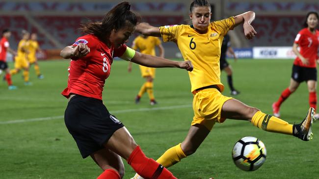 Chloe Logarzo tries to cut short a rare South Korean attack.