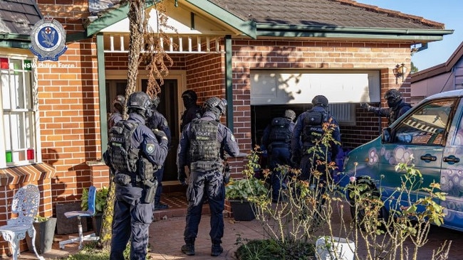 Officers on a search warrant outside the jeweller’s home. Picture: NSW Police