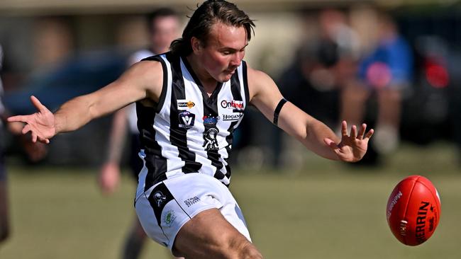 Brodie Gilchrist gets a kick for Wallan. Picture: Andy Brownbill