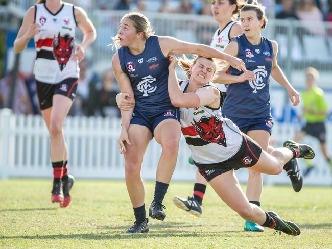 Camilla Burnett from Yeronga South Brisbane tackles Tarni White from Coorparoo (AAP Image/Richard Walker)