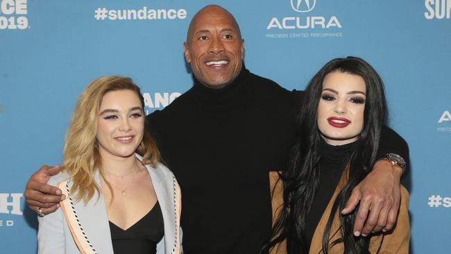 Florence Pugh, producer and cast member Dwayne Johnson, and WWE's Paige pose at the premiere of the film Fighting With My Family in Utah in the US.