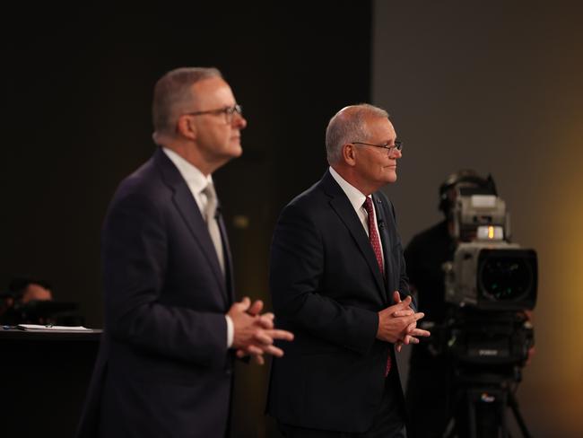 BRISBANE, AUSTRALIA - APRIL 20: Leader of the Opposition Anthony Albanese (L) and Australian Prime Minister Scott Morrison attend the first leaders' debate of the 2022 federal election campaign at the Gabba on April 20, 2022 in Brisbane, Australia. The debate, hosted by Sky News Australia and The Courier-Mail, see Morrison and Albanese go head-to-head in the presence of 100 undecided voters. (Photo by Jason Edwards - Pool/Getty Images)