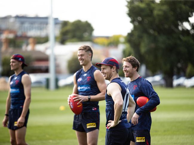 Melbourne training. Former Dogs pair Josh Schache, Lachie Hunter with assistant coach Reece Conca. Picture: David McPherson