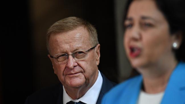 AOC President John Coates watches Queensland Premier Annastacia Palaszczuk during a press conference. Picture: NCA NewsWire/Dan Peled