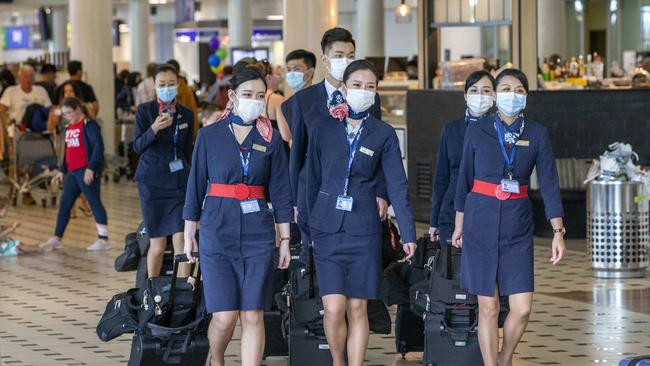 Air crew arriving at Brisbane International Airport on Monday. Picture: AAP Image/Richard Walker