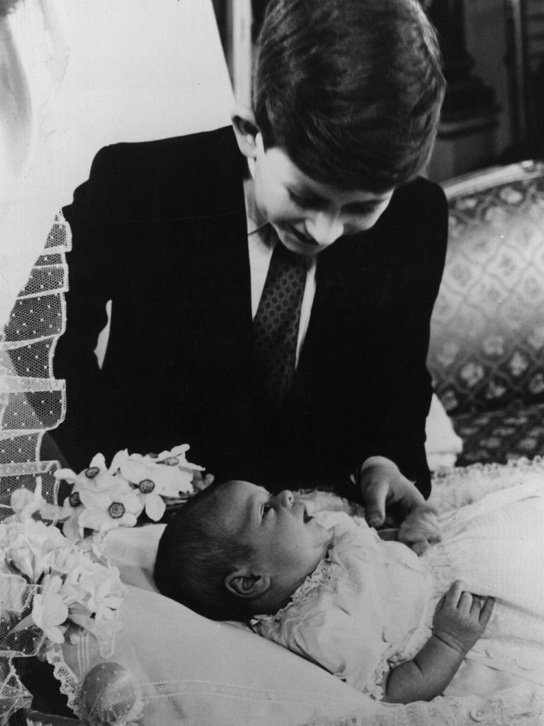 Prince Charles admires his baby brother, Prince Andrew, shortly after his birth in March 1960. Editor-in-chief of <i>Majesty</i> magazine Ingrid Seward wrote in 2015 that the Queen’s second son “was forever making mischief as a child, but he was always a favourite with the Queen”. Picture: Hulton Archive/Getty