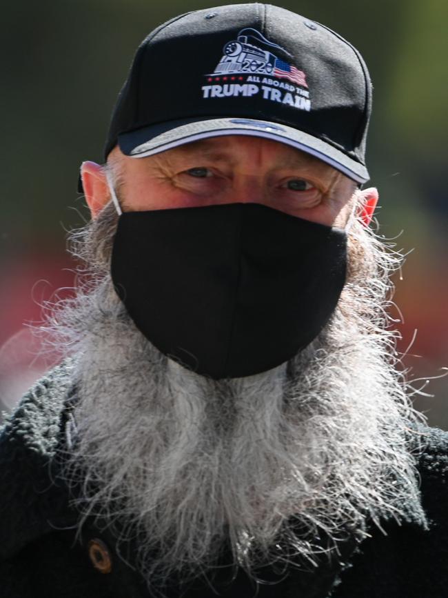 A man wears a mask as he takes a walk in Melbourne. Picture: AFP