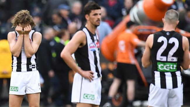 Chris Mayne, Scott Pendlebury, Steele Sidebottom react after the final siren. Picture: AAP Images