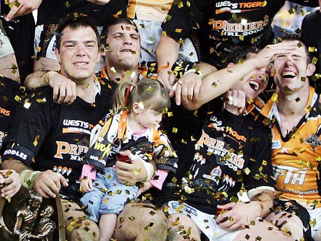 Winners Wests Tigers team photo after the Australian 2005 National Rugby League (NRL) Grand Final match North Queensland Cowboys v Wests Tigers in Sydney, Sunday, Oct. 2, 2005. Wests Tigers won 30 - 16. (AAP Image/Jenny Evans) NO ARCHIVING, INTL OUT