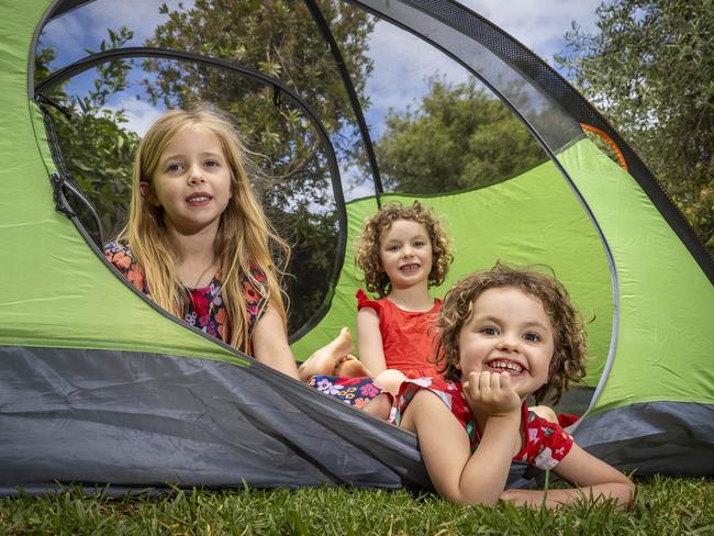 With cost of living costs biting the average Victorian family bank account - holidaying locally is higher than normal for families this year. Naoise (6), Loki (3) and Tilly (6) camp in the backyard. Picture: Jake Nowakowski