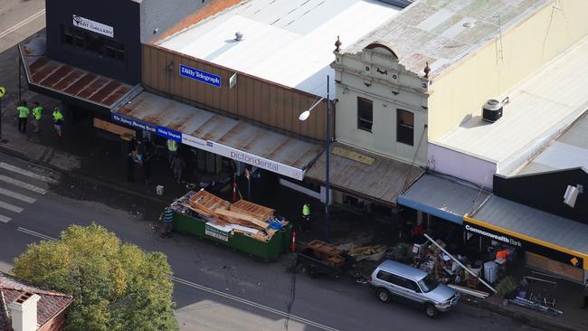 The main street of Picton is full of skip bins as locals mop up. Picture: Toby Zerna