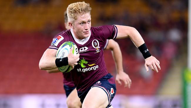 Isaac Lucas of the Reds breaks away from the defence during a Super Rugby match in 2020. Picture: Getty Images