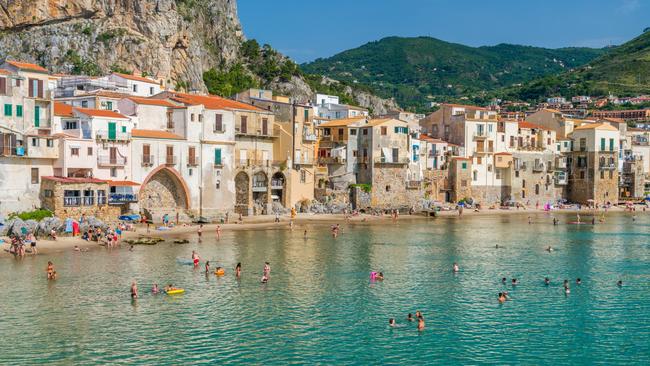 Beachgoers enjoy the water in Palermo in Sicily, southern Italy. Picture: Istock