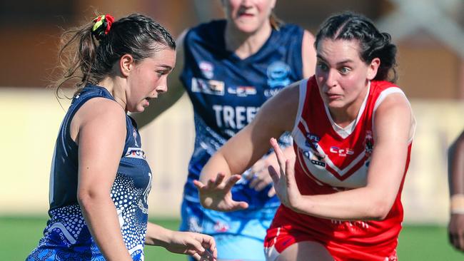 Janna Ransome under pressure from Kaitlyn Bailey as Waratahs V The Buffettes at TIO Stadium in round 2 of the NTFL 22-23 Comp.Picture Glenn Campbell