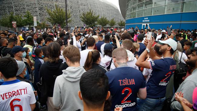People gather outside the Parc des Princes stadium before Messi arrives. Picture: Zakaria ABDELKAFI / AFP