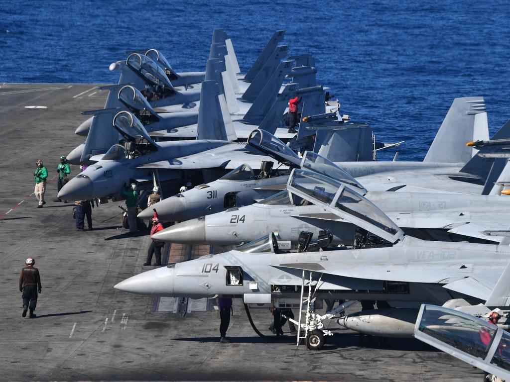 Aircraft are seen on the flight deck of the USS Ronald Reagan, off the coast of Queensland, Australia, Friday, July 12, 2019. Australian Prime Minister Scott Morrison visited the Nimitz-class aircraft carrier USS Ronald Reagan as it takes part in Exercise Talisman Sabre 2019, which is a bilateral training exercise involving 34,000 military personnel from Australia, the United States, New Zealand, Canada, the United Kingdom and Japan. (AAP Image/Darren England)