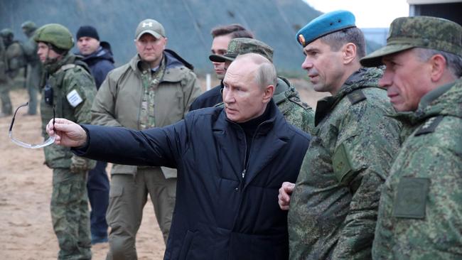 Russian President Vladimir Putin meets soldiers during a visit at a military training centre of the Western Military District for mobilised reservists, outside the town of Ryazan.