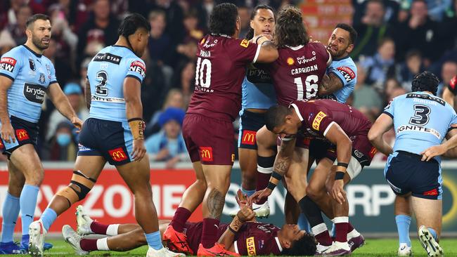 Jarome Luai and the Maroons come together after Selwyn Cobbo was knocked out. Picture: Chris Hyde/Getty Images