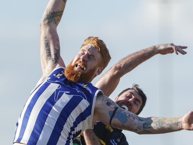 Football MPNFL Division 2: Langwarrin v Dromana. Rory Gregg (Dromana) and Matthew Naughton (Langwarrin). Picture: Valeriu Campan