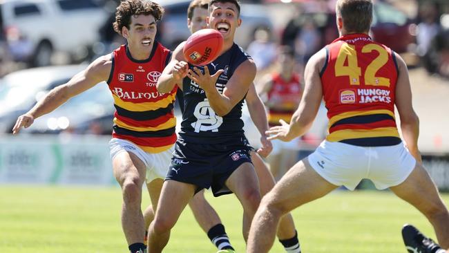 Hayden Sampson of the Panthers handballs during the Round 1 SANFL match between South Adelaide and Adelaide at Flinders University Stadium in Adelaide, Friday, March 29, 2024. (SANFL Image/David Mariuz)