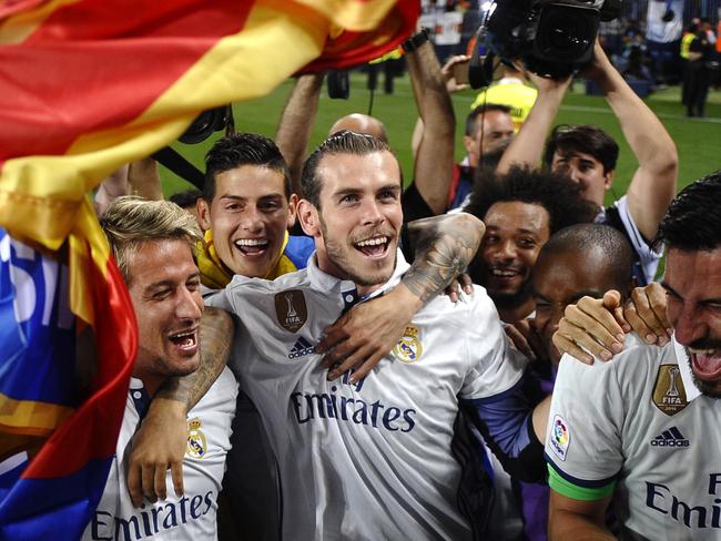 Real Madrid's Gareth Bale celebrates with teammates.