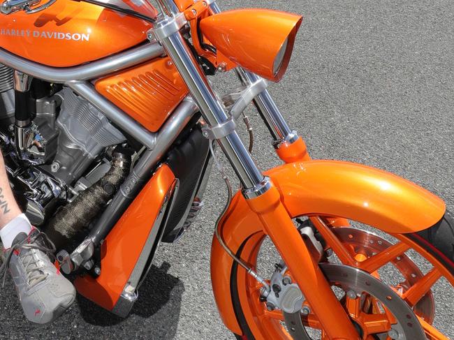 A disqualified driver was caught riding an orange Harley Davidson with a pillion passenger. Generic file photo.