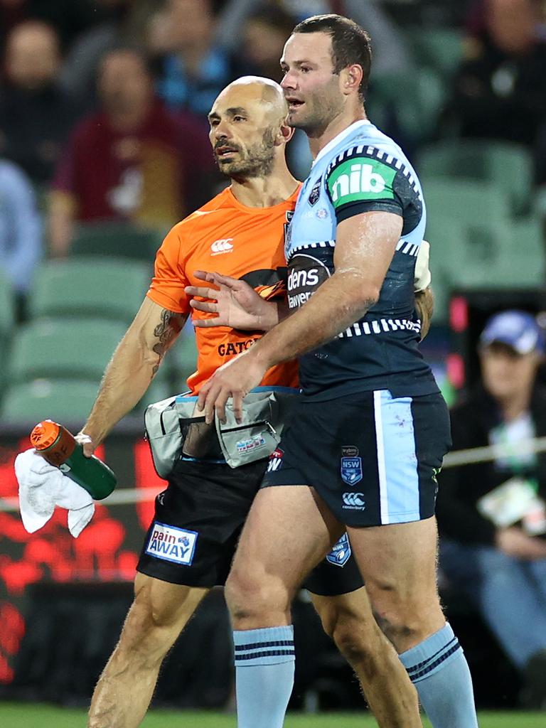 Boyd Cordner is helped from the field in Origin I. Picture: Cameron Spencer/Getty Images