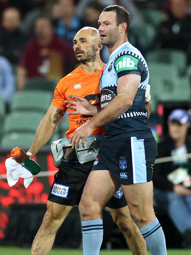 Boyd Cordner is helped from the field in Origin I. Picture: Cameron Spencer/Getty Images