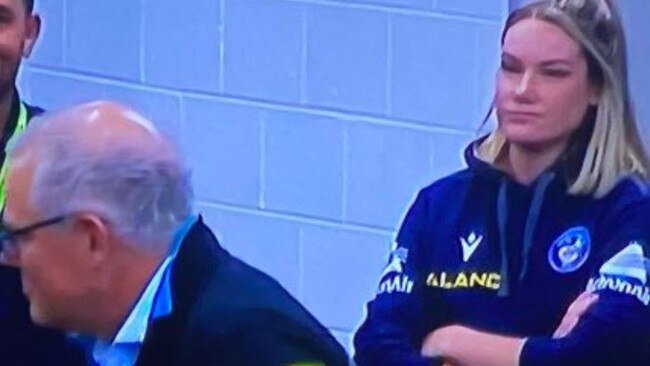 Eels sports scientist Tahleya Eggers glares at Prime Minister Scott Morrison after he addressed the Parramatta players in the sheds on Saturday night.