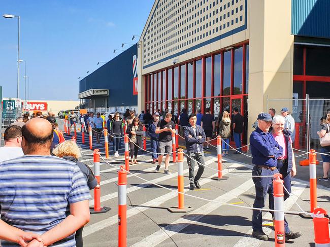 Shoppers waiting to enter Bunnings amid the coronavirus pandemic. Picture: Brenton Edwards