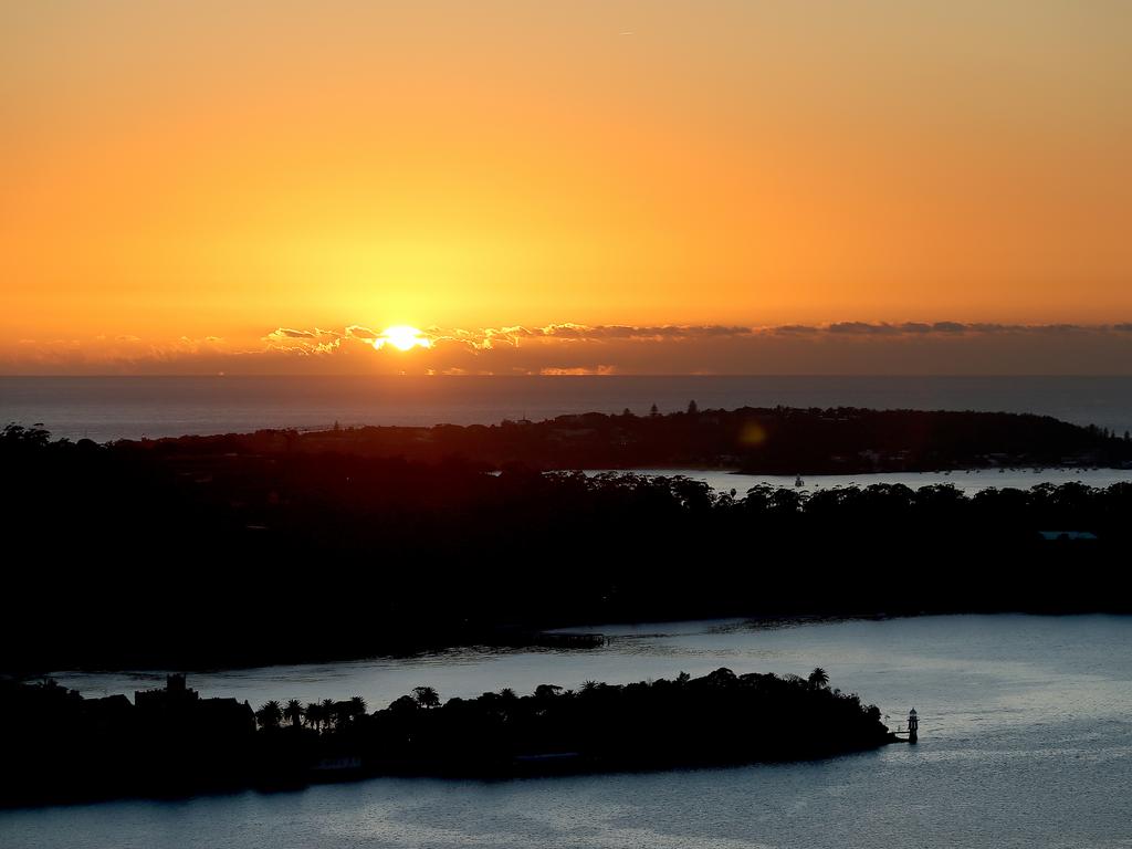 A dawn service was held on the summit of the Sydney Harbour Bridge to commemorate ANZAC Day. Sunrise from the top of the bridge looking over North Head. Picture: Toby Zerna