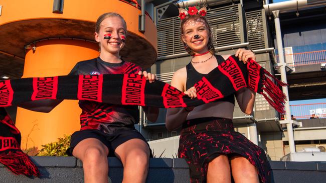 Flora Hackenberg and Marjorie Hackenberg as thousands of fans gathered for the AFLW Dreamtime game between Richmond and Essendon in Darwin. Picture: Pema Tamang Pakhrin