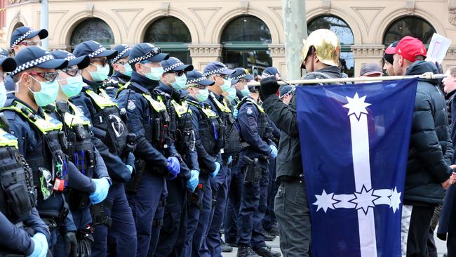 Protesters are met by a wall of police. Picture: Matrix