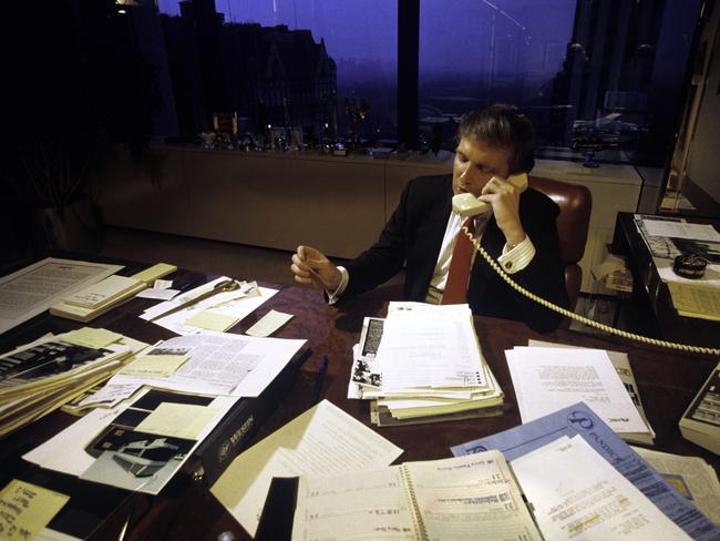 Before politics, Donald Trump spent most of his day attending board meetings managing the construction of his buildings in New York City. This photograph was taken in August 1987. Picture: Joe McNally/Getty Images