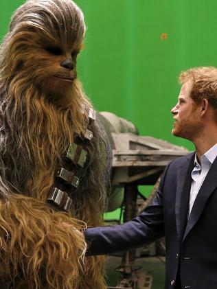 Britain's Prince Harry meets Chewbacca on set this week. Picture: Adrian Dennis, Pool via AP.