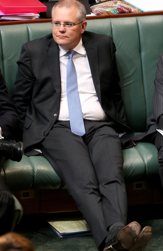 Immigrations and Border Protection Minister Scott Morrison listens during Question Time.