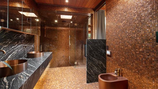 It features a glamorous, renovated ensuite with mosaic tiles and a sunken shower, spa and steam room.