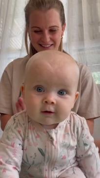 Adorable moment baby dribbles after getting massage from mum