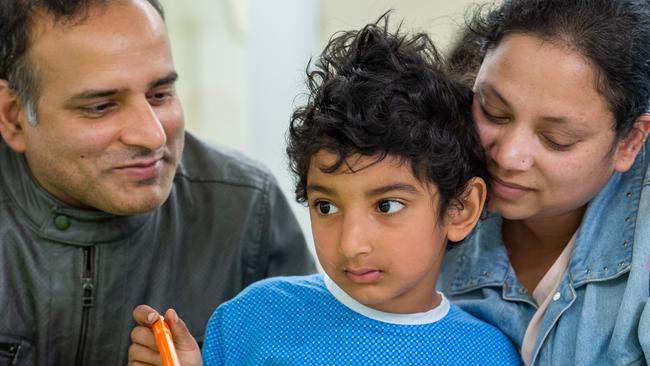 Shriyanash Singh, 5, with his parents Tarun Kumar and Jyotsana Singh after being involved in a hit-run on Thursday night. Picture: Jay Town