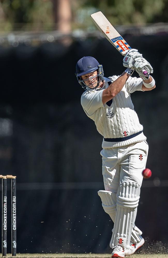 Evan Gulbis drives down the ground during his century.