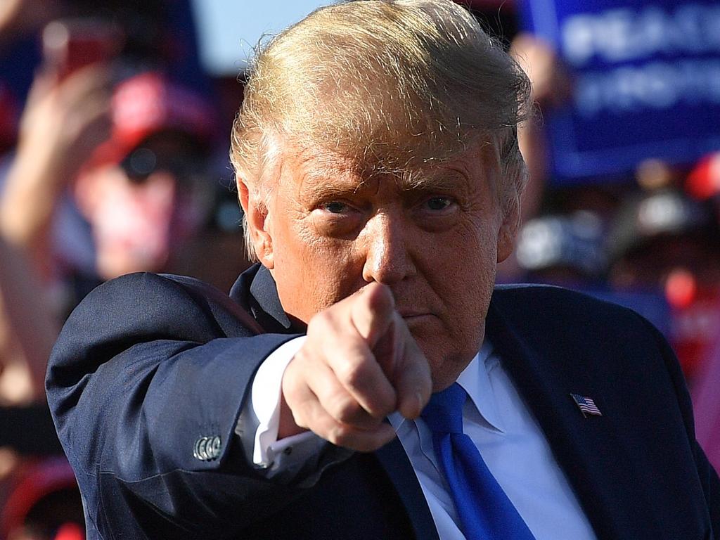 TOPSHOT – US President Donald Trump gestures as he speaks during a rally at Carson City Airport in Carson City, Nevada on October 18, 2020. (Photo by MANDEL NGAN / AFP)