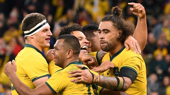 Kurtley Beale of the Wallabies (centre) celebrates with team mates after scoring a try during the Bledisloe Cup match between the Australian Wallabies and the New Zealand All Blacks at Optus Stadium in Perth, Saturday, August 10, 2019.  (AAP Image/Dave Hunt) NO ARCHIVING, EDITORIAL USE ONLY