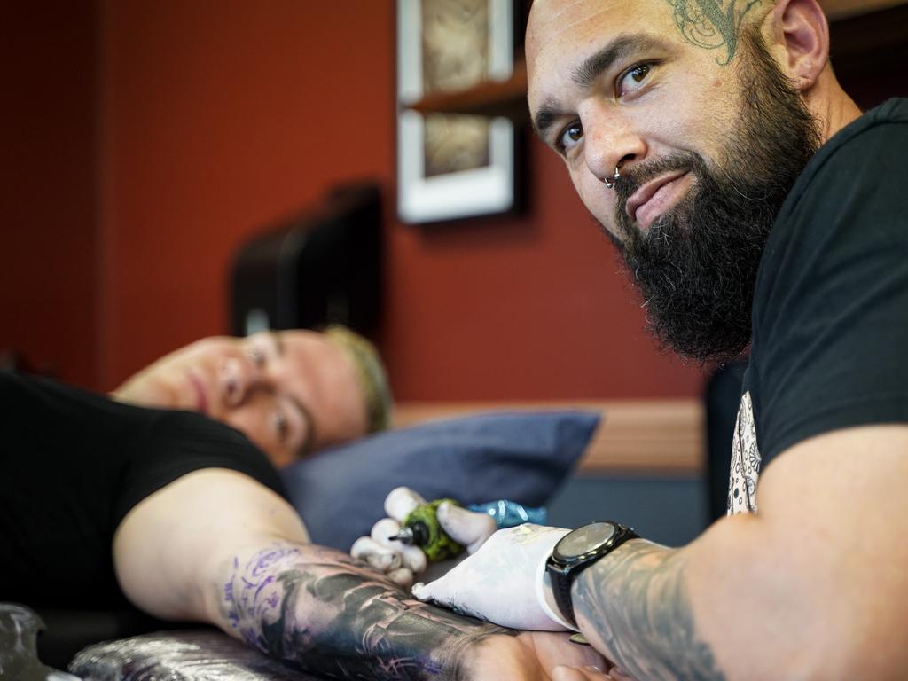 Tri Tone Tattoo owner and tattooist Mitchell Brammer working on a realism horror piece for Mitchell Norton. Picture: Heidi Petith