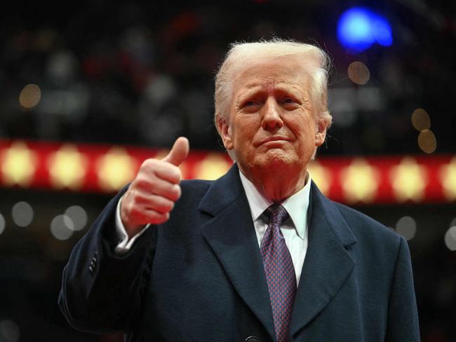 Donald Trump give the thumbs up during his inaugural parade. Picture: Jim Watson